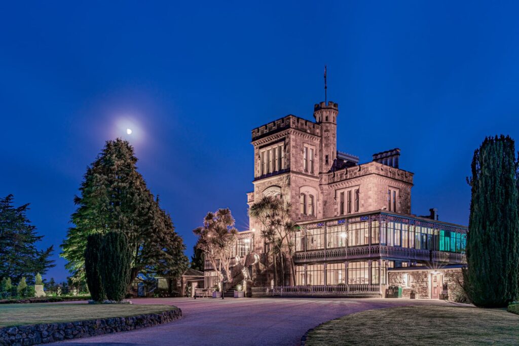 exterior view of Larnach Castle lit up at night