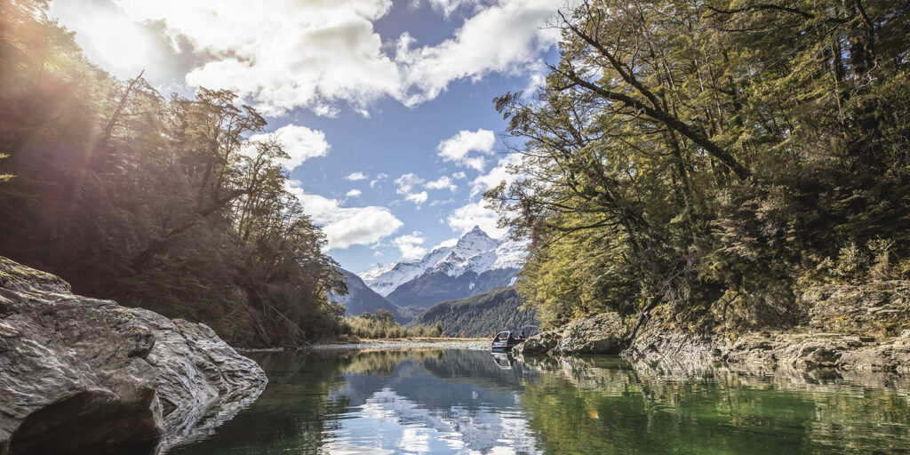 Tranquil Glenorchy river on a sunny day.