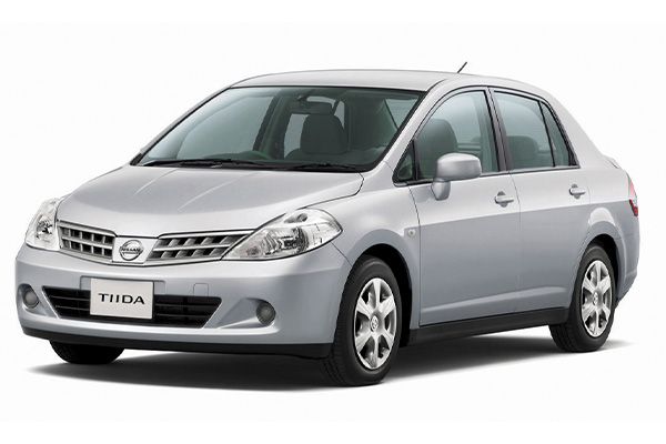 Silver Nissan Tiida.