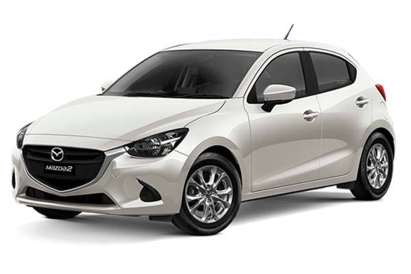 White Mazda Demio.