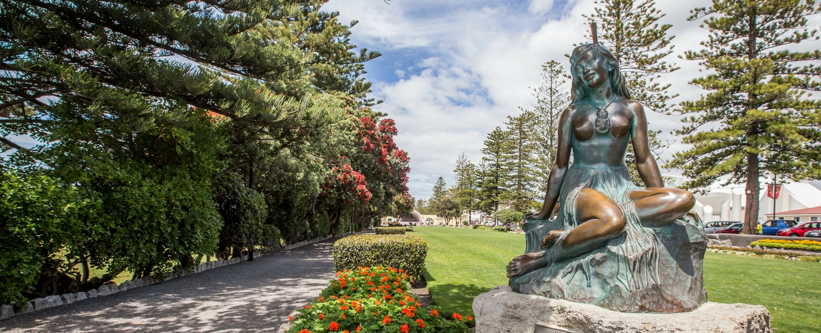 statue in a beautiful garden with trees