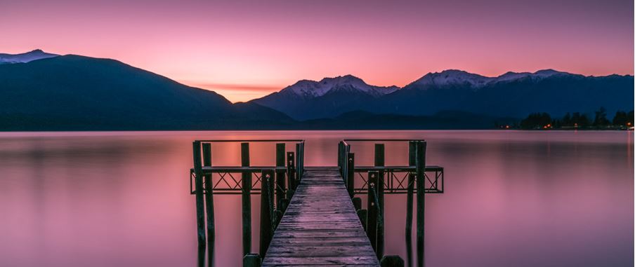 a gorgeous image of the wharf in Te Anau overlooking the sea.