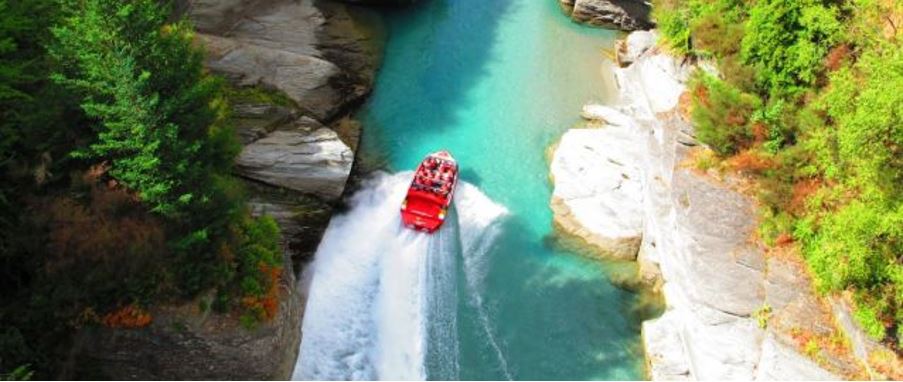 high speed jet boat ride on the river in a canyon in Queenstown.