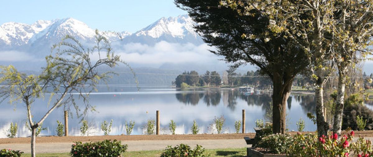 scenery of lake te anau overlooking mountains.