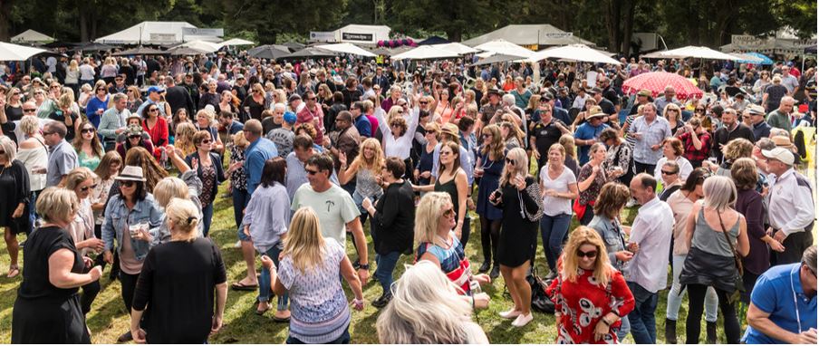 A large crowd having fun while at the Wairarapa Wine Festival.